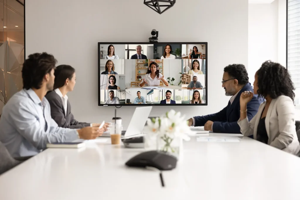 Modern tech innovation for business communication. Diverse team collaborate during hybrid online
